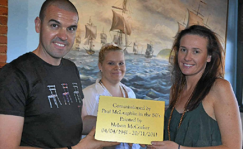 Seth Jameson and his sister, Virginya McCosker, with the plaque prepared for the painting done by their father, Nelson McCosker. Palace Hotel bar manager Jade Hickey is also pictured. Seth Jameson and his sister, Virginya McCosker, with the plaque prepared for the painting done by their father, Nelson McCosker. Palace Hotel bar manager Jade Hickey is also pictured.
